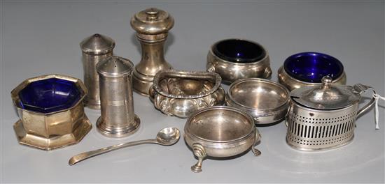 Six assorted silver table salts, a silver mustard pot, pepper grinder and pair of cylinder pepperettes.